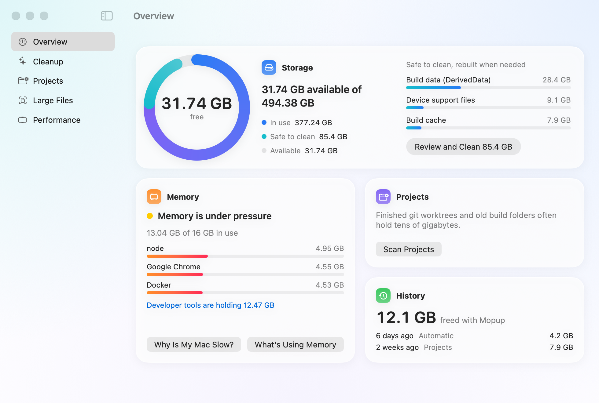 Mopup's overview on a demo Mac: a ring showing 31.74 GB free of 494 GB with 85.4 GB safe to clean and the biggest of those items beside it, memory under pressure with the apps using the most and developer tools holding 12.47 GB, and 12.1 GB freed so far.