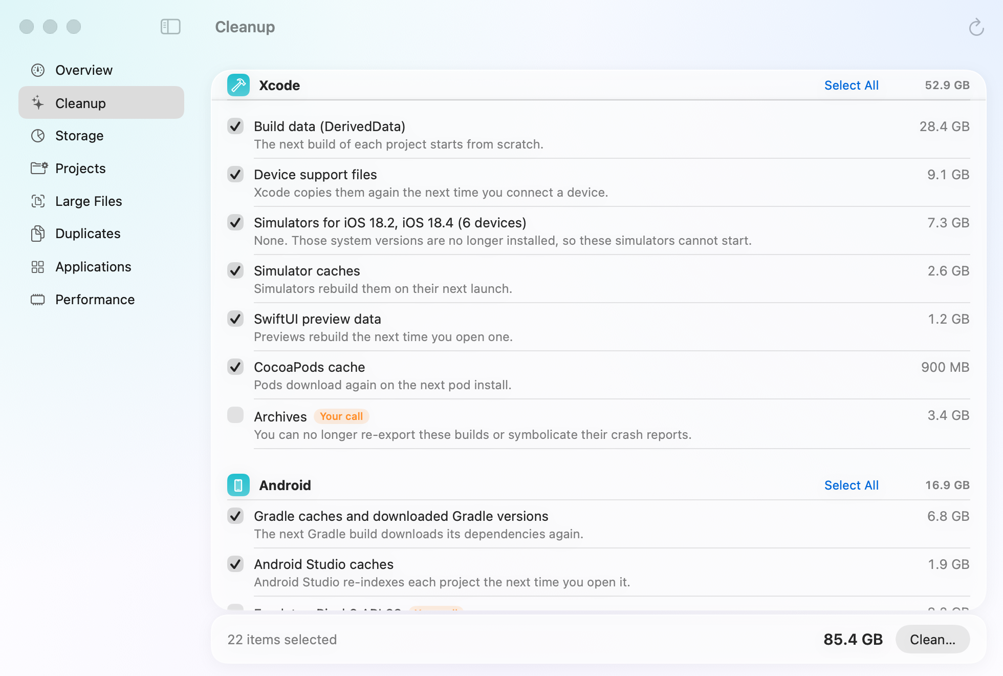 Mopup's Cleanup section on a demo developer Mac: Xcode build data at 28.4 GB, device support files, simulators for iOS versions no longer installed, simulator caches, SwiftUI preview data and the CocoaPods cache ticked, and Archives marked Your call.
